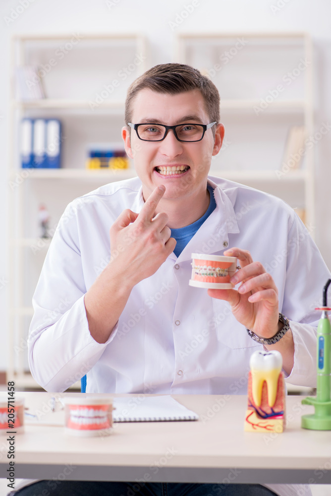 Dentist working teeth implant in medical lab Dentist working teeth implant in medical lab