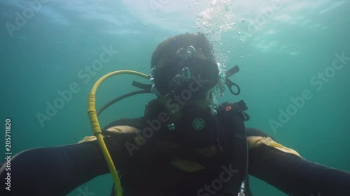 Wallpaper Mural Diver in equipment with regulator in mouth under the water. Face diver in mask close-up. Torontodigital.ca