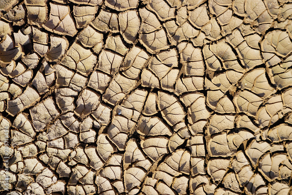 Dry ground cracked from hot air Dry ground cracked from hot air