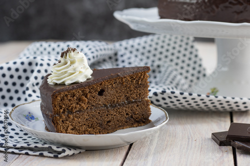 Slice of a cake with whipped cream