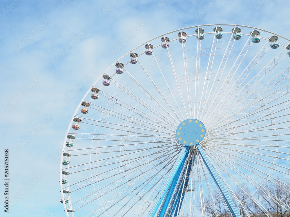 ferris wheel against the blue sky ferris wheel against the blue sky