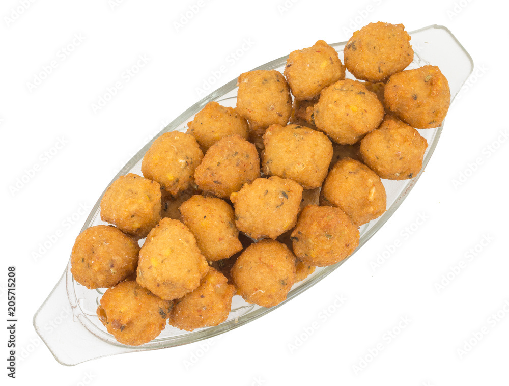Indian Spicy Street Food Dal Vada Also Know as Moong Dal Vada, Pakoda, Pakode, Pakore, Moong Vada, Pakora or Bhajiya isolated on White Background Indian Spicy Street Food Dal Vada Also Know as Moong Dal Vada, Pakoda, Pakode, Pakore, Moong Vada, Pakora or Bhajiya isolated on White Background