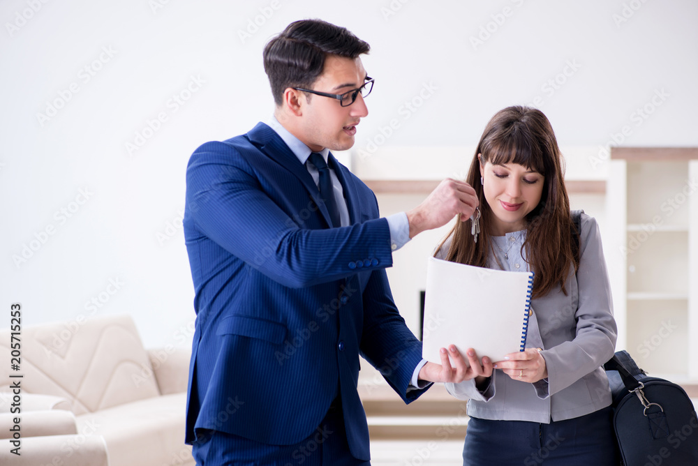 Real estate agent showing new apartment to owner Real estate agent showing new apartment to owner