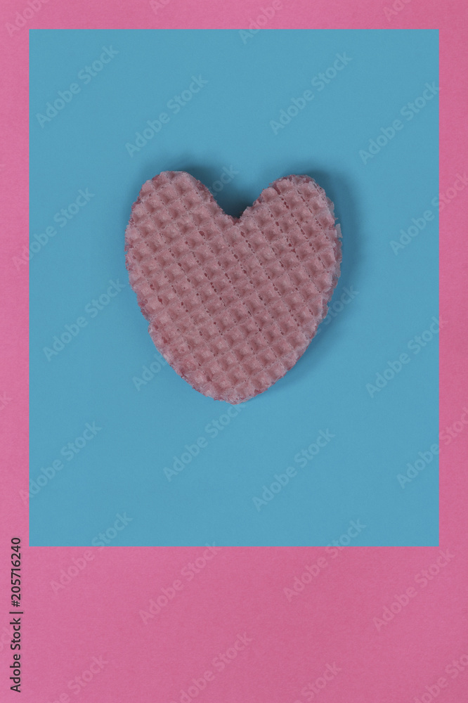 Creative heart from an edible wafer in pastel pink and blue colors. Abstraction. Template. Creative heart from an edible wafer in pastel pink and blue colors. Abstraction. Template.