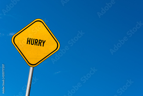 Fotografie hurry - yellow sign with blue sky