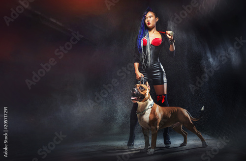 Сool asian girl with a baseball bat and terrier   American Staffordshire  © Glebstock