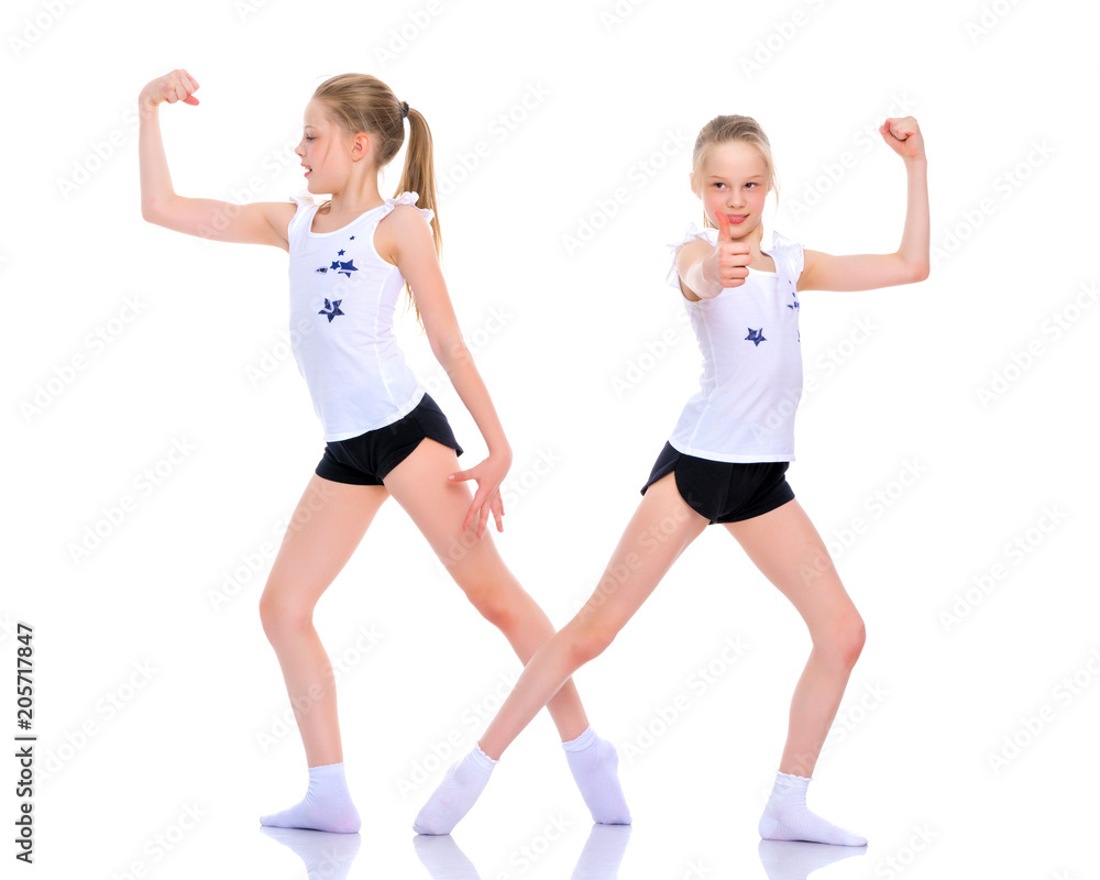 Girls gymnasts show their muscles. Girls gymnasts show their muscles.