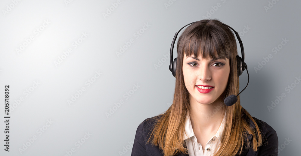 Young female telemarketer on a white background Young female telemarketer on a white background