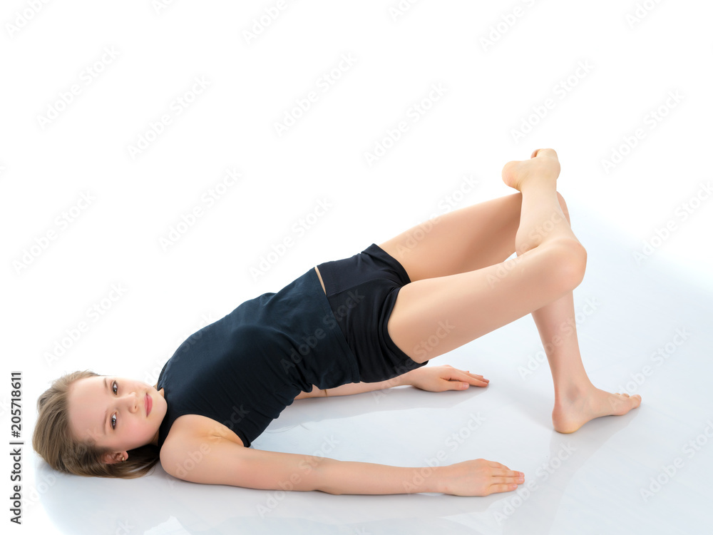 The gymnast perform an acrobatic element on the floor. The gymnast perform an acrobatic element on the floor.