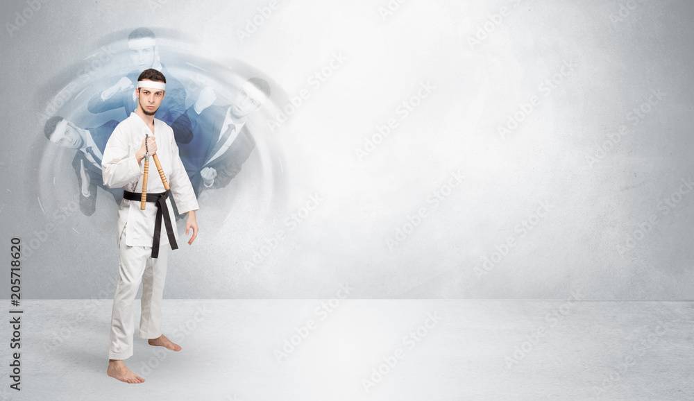 Young businessman in suit fighting with empty wall background
Young businessman in suit fighting with empty wall background