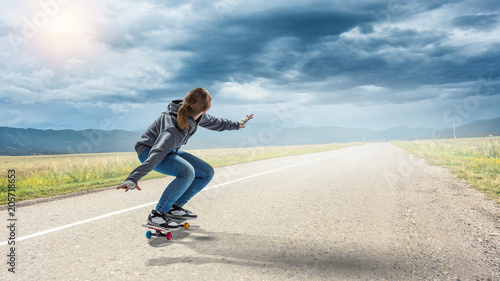 Teenager girl ride her skateboard. Mixed media