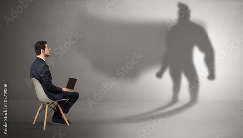 Photography Humble businessman staying and offering stuffs to a superhero shadow