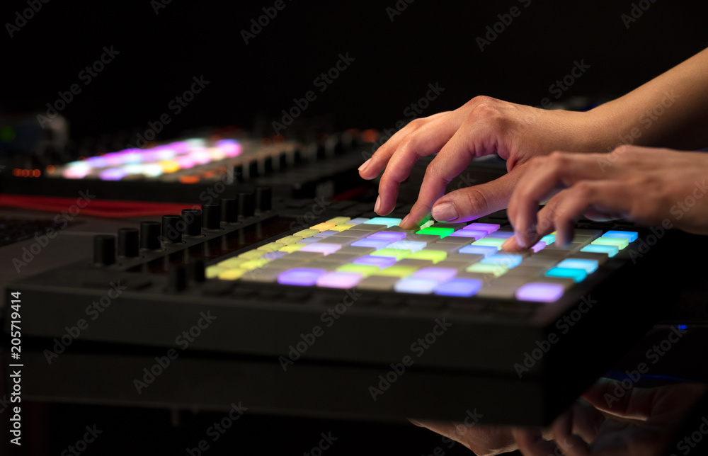 Dj hand remixing music on midi controller
Dj hand remixing music on midi controller