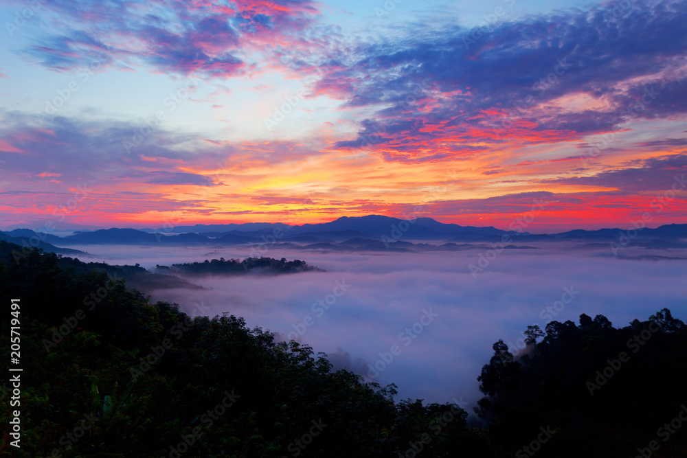 Beautiful sunrise or sunset with fog flowing in the mountain beautiful landscape scenery view in thailand.