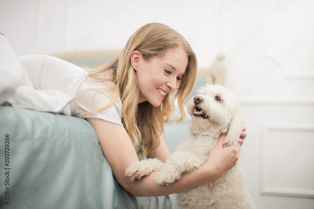 Smiling girl hugging her dog Smiling girl hugging her dog