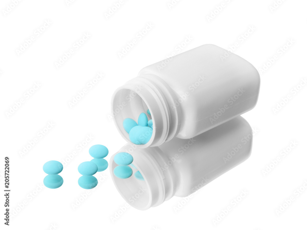 Bottle with pills on mirror surface Bottle with pills on mirror surface