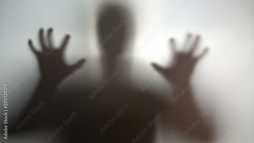 Mysterious silhouette with hands up, going to scare, nightmare person in stress Mysterious silhouette with hands up, going to scare, nightmare person in stress