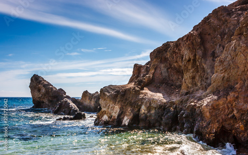 Rock cliffs at Playa del Papagayo (Parrot Beach). Lanzarote, Canary Islands, Spain.