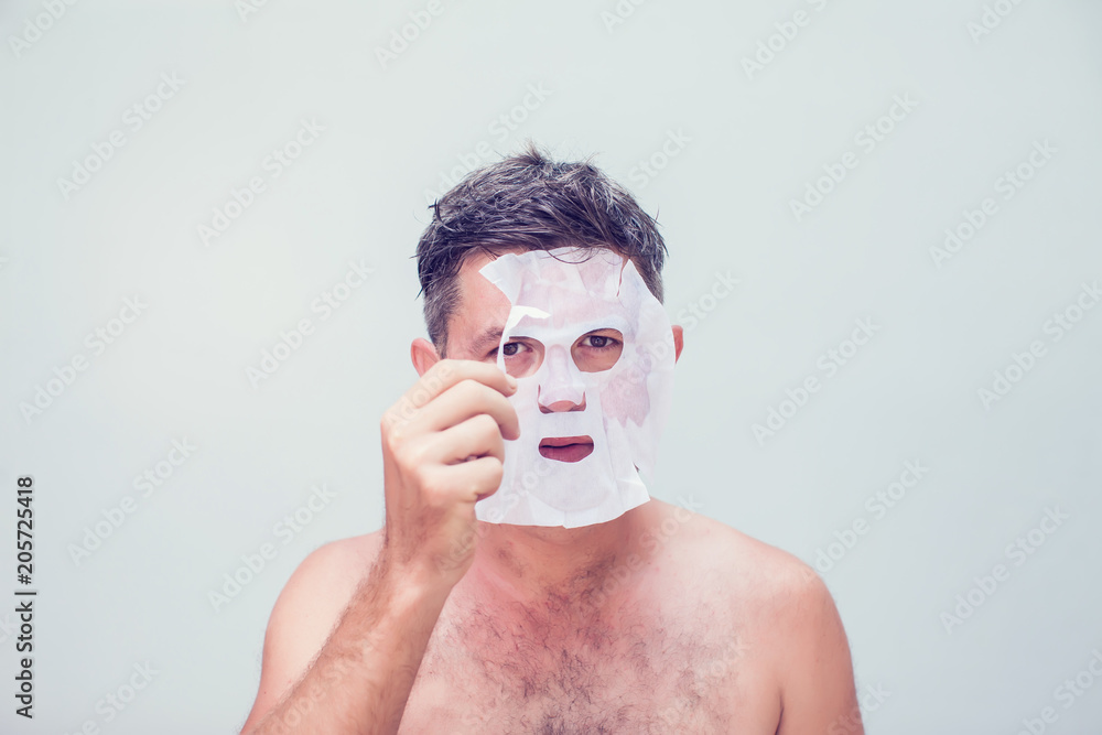 man in a cosmetic mask skin care man in a cosmetic mask skin care