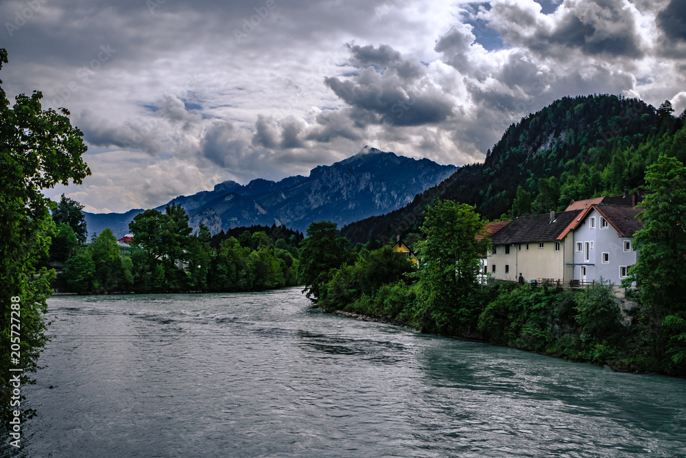 Fototapeta premium Traditional, colorful buildings and the river Lech in the historic old town of Füssen, a romantic medieval city on the Romantic Road in Bavaria, Germany