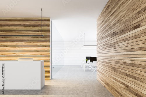 White reception counter in a wooden wall office photo