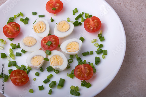 natural nutritious diet vegetable salad of tomatoes and quail eggs