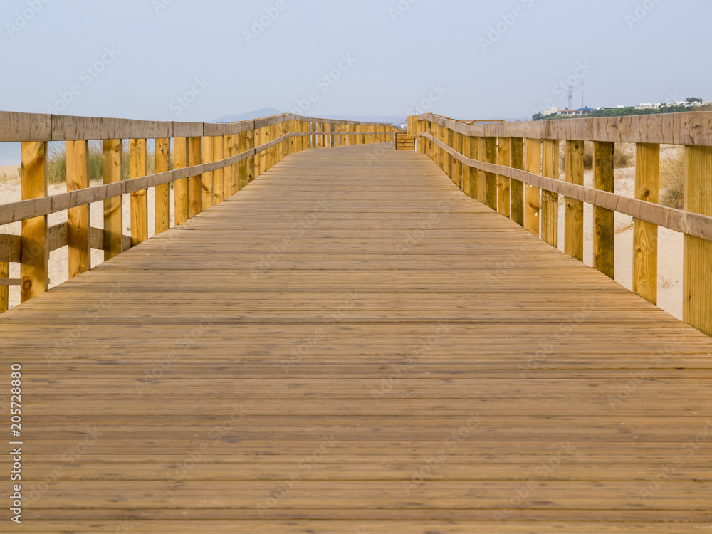 wooden footbridge on the beach