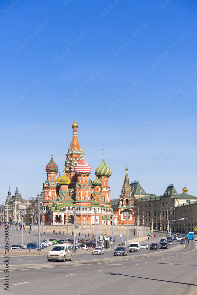 Moscow,Russia, St. Basil's Cathedral and Kremlin Walls and Tower in Red square in sunny blue sky. Red square is Attractions popular's touris in russia