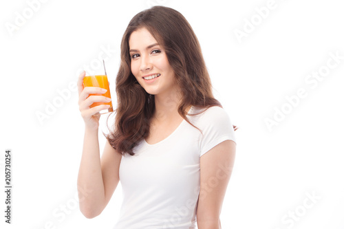 Portrait of a woman drinking orange juice. Orange juice in glass