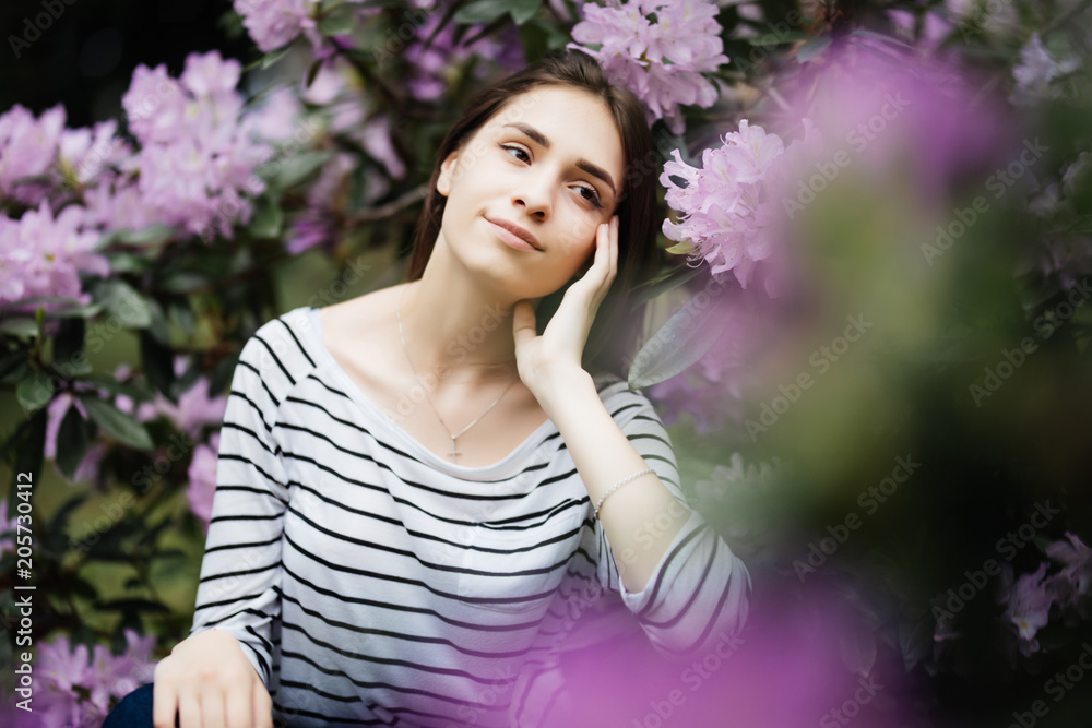Beautiful young woman on purple background. Beauty woman with purple flowers Beautiful young woman on purple background. Beauty woman with purple flowers