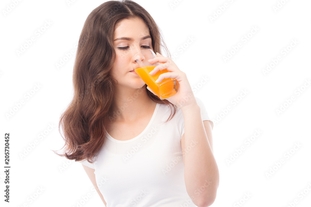 Portrait of a woman drinking orange juice. Orange juice in glass Portrait of a woman drinking orange juice. Orange juice in glass