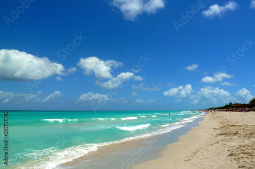 Tropical beach  sea  waves and sky with clouds