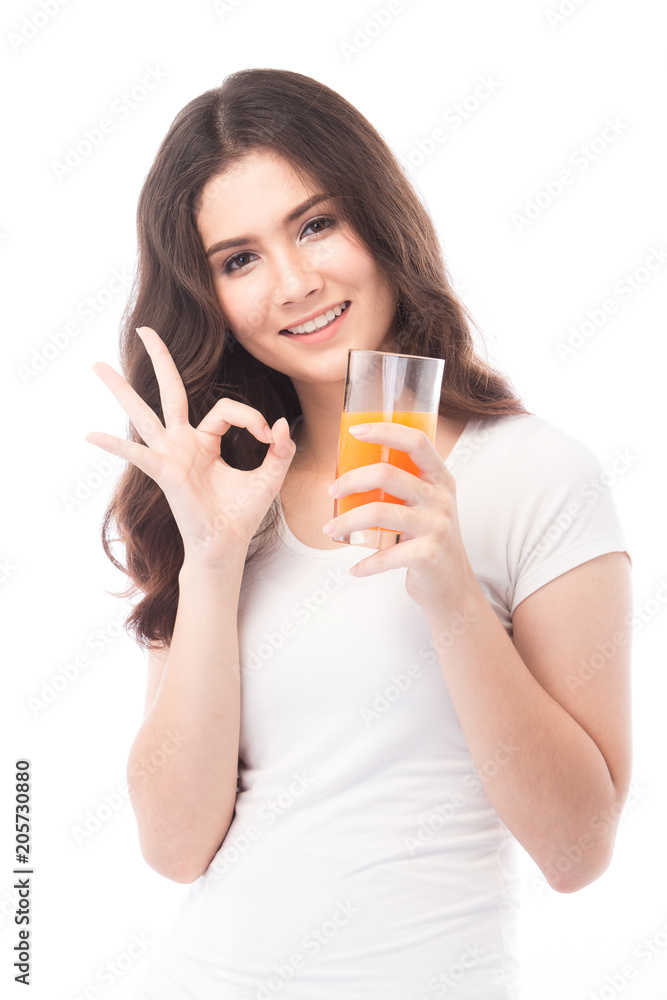 Portrait of a woman drinking orange juice. Orange juice in glass Portrait of a woman drinking orange juice. Orange juice in glass