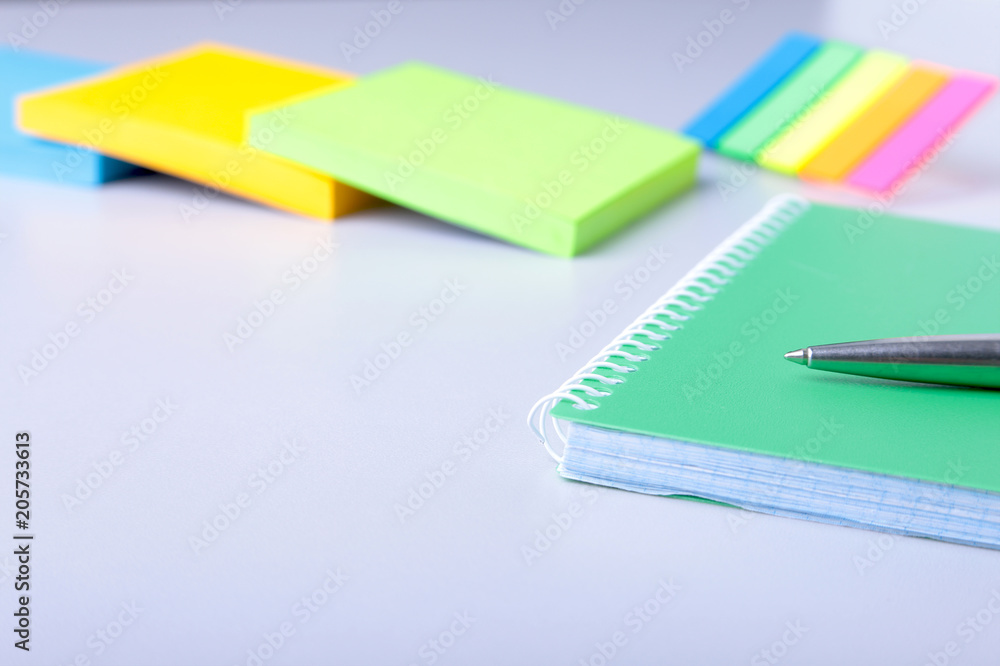 Business concept. Top view of kraft spiral notebook, glasses and pen isolated on background for mockup. Business concept. Top view of kraft spiral notebook, glasses and pen isolated on background for mockup.