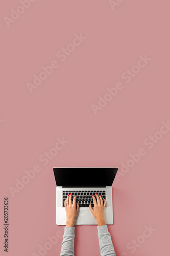 Woman working on laptop. Business background with copy space.