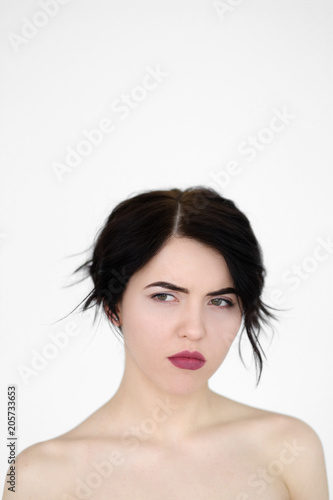 emotion face. sad depressed downcast gloomy low spirited woman. young beautiful brunette girl portrait on white background.