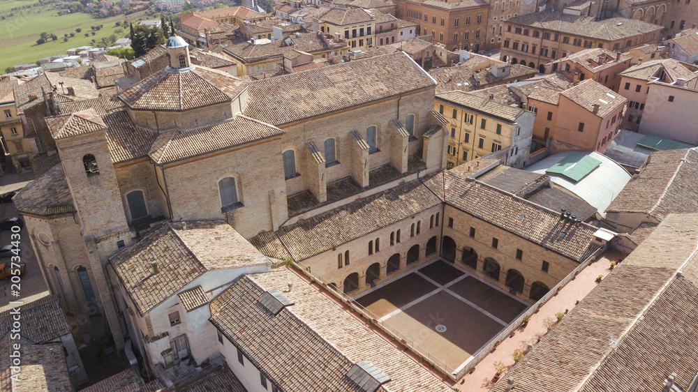 Aerial view of the inner courtyard of an ancient medieval church built of bricks. The church is located in the historic center of Osimo in the Marche.