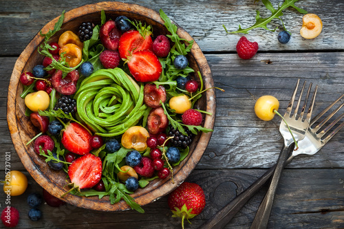 Fresh salad with fruit,berry and vegetables.