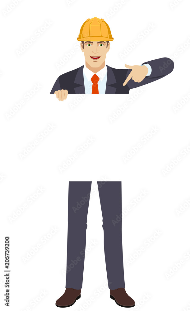 Businessman pointing finger at white blank poster