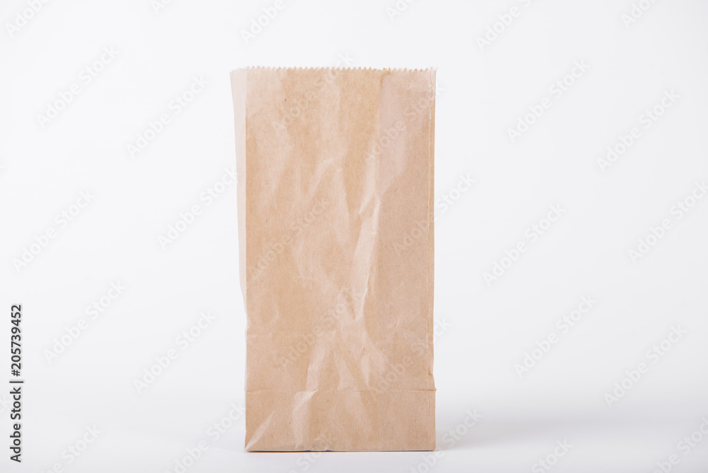 Blank brown paper bag for mockup template advertising and branding background. Blank brown paper bag for mockup template advertising and branding background.