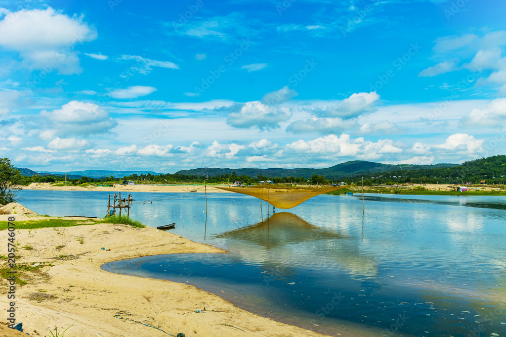 River scenery with wooden boat and fishing net in Phu Yen province, Vietnam