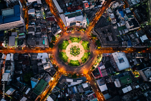 Photography Aerial view of roundabout or circle of road with light trails on the road at night in Bangkok,Thailand