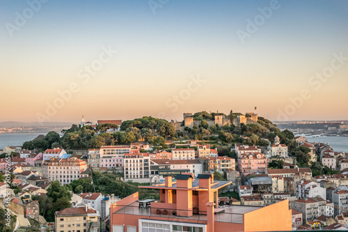 A panoramic view of the sunset over the Saint George Castle in Lisbon