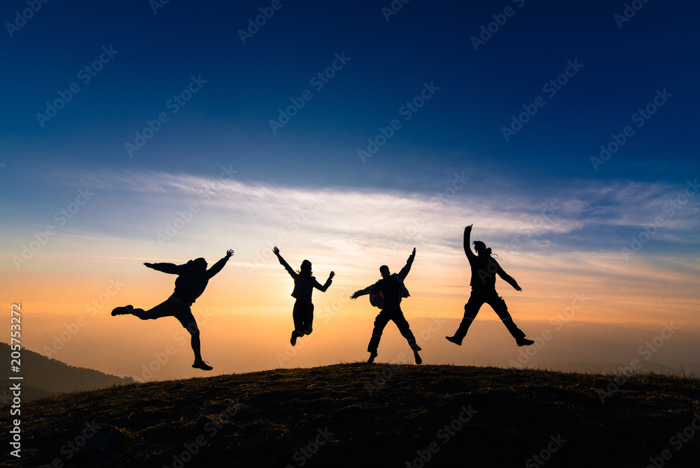 silhouette of friends jumping in sunset for happiness,fun and team work concept silhouette of friends jumping in sunset for happiness,fun and team work concept