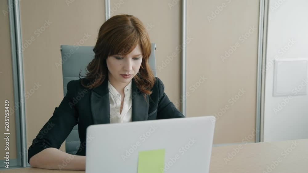 Portrait of female boss working in the office. Concept of: business people, office interior, laptop on desk, managing director. Portrait of female boss working in the office. Concept of: business people, office interior, laptop on desk, managing director.