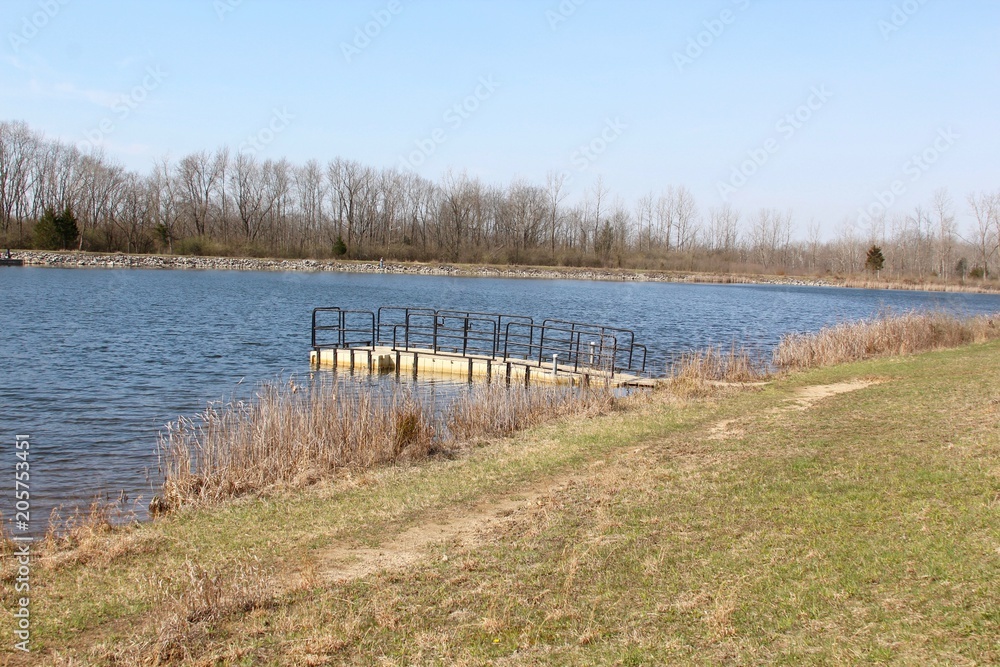 The view of the small fishing dock and the lake. The view of the small fishing dock and the lake.