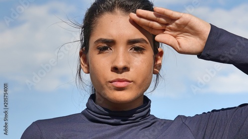 Youthful Colombian Teenager Girl Saluting