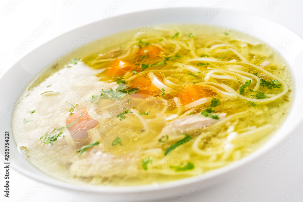 Chicken or beef soup with noodles carrot and parsley herb