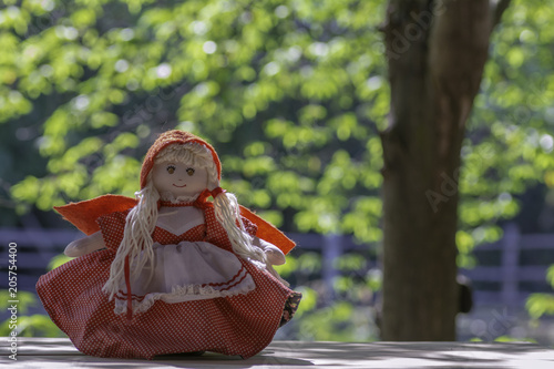 Little Red riding hood doll on Little Red Riding Hood on Bokeh Background