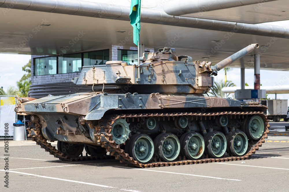 Brazilian battle tank, with the flag of Brazil, on display for people to know 